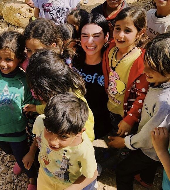 a group of children standing next to each other