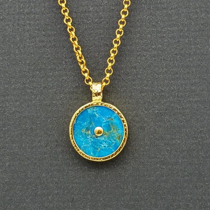 Handmade Gold Turquoise Necklace With Round Pendant, Luxury Turquoise Pendant Necklace, Luxury Turquoise Necklace With Cabochon, Turquoise Necklaces With Coin Pendant Medallion, Luxury Turquoise Round Necklace, Turquoise Necklace With Coin Pendant As A Gift, Luxury Round Turquoise Necklace, Yellow Gold Medallion Necklace With Cabochon, Luxury Yellow Gold Turquoise Necklace As Gift