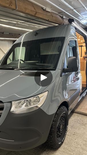 a grey van parked inside of a garage