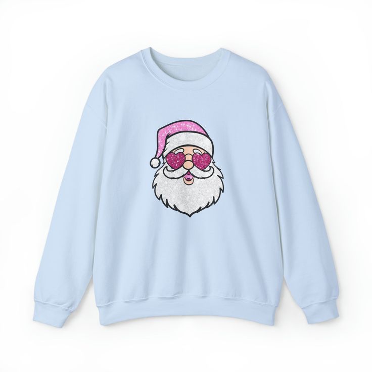 Meet our Glitzy Claus Christmas sweatshirt, where Santa doesn't just come down the chimney—he makes a grand entrance in pink glitter and shades! Ideal for any situation, a unisex heavy blend crewneck sweatshirt is pure comfort. These garments are made from polyester and cotton. This combination helps designs come out looking fresh and beautiful. The collar is ribbed knit, so it retains its shape even after washing. There are no itchy side seams on these sweaters. Made with a medium-heavy fabric blend of 50% cotton and 50% polyester (8.0 oz/yd² (271.25 g/m²)), this sweatshirt feels cozy and is the perfect choice for those colder months. The classic fit along with the crew neckline deliver a comfy wearing experience with a clean-cut style. Meanwhile, the double-needle stitching at the should Casual Winter Party Sweatshirt, Winter Party Sweatshirt With Crew Neck, Winter Party Crew Neck Sweatshirt, Winter Crew Neck Top With Glitter Print, Winter Glitter Print Crew Neck Top, Christmas Crewneck Sweatshirt, Dont Stop Believing, Green Ash, New Groove