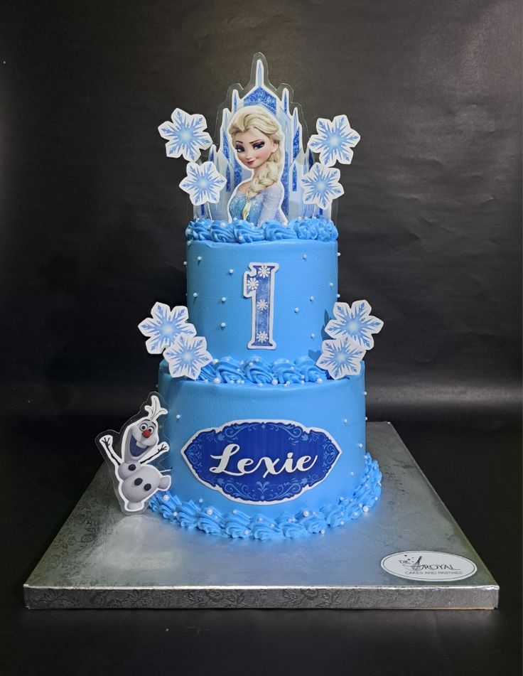 a frozen princess cake with the number one on it