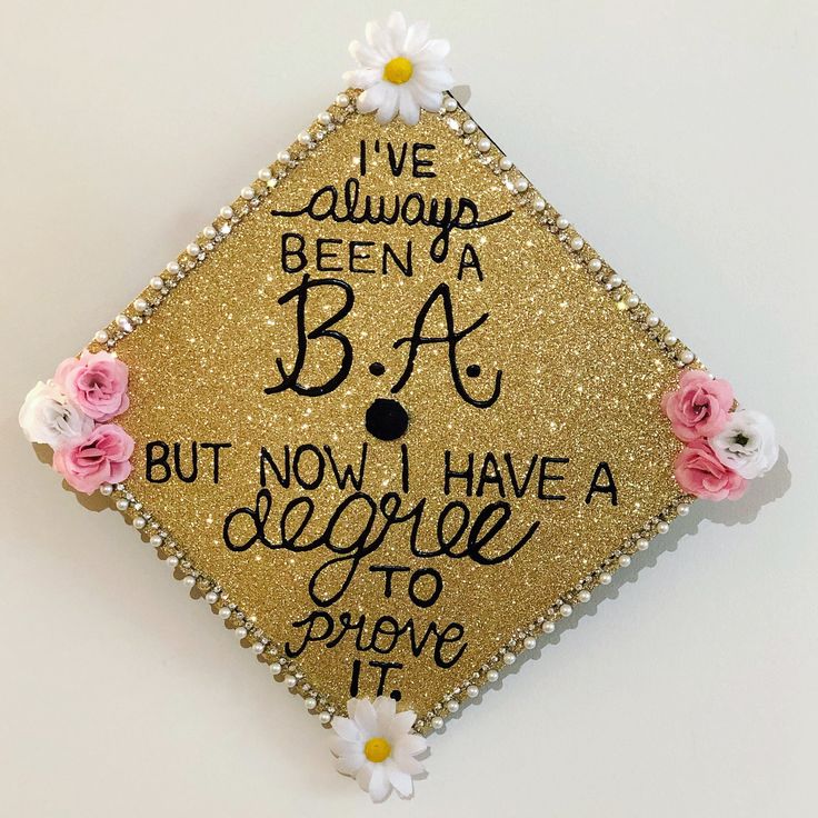 a decorated graduation cap with flowers and writing on the side that says, i've always been a b a but now i have a degree to prove it