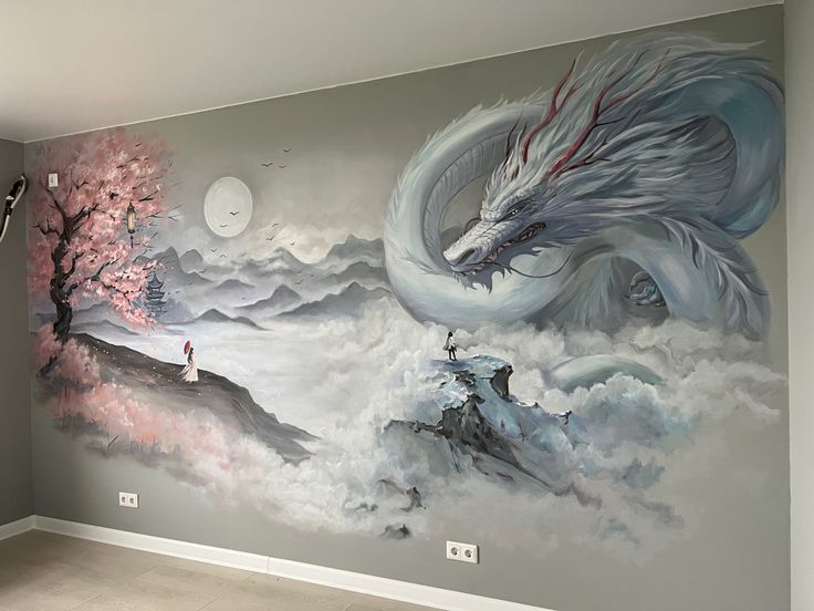 a large mural painted on the side of a wall with a dragon and man standing in front of it