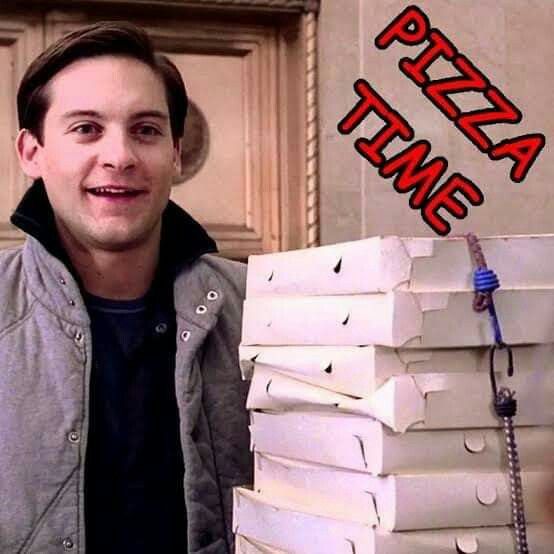 a man standing in front of stacks of pizza boxes with the words pizza time on it