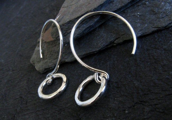 "Our dainty sterling silver minimalist ring earrings are nice and small as well as very lightweight. For days when you just want a touch of shine, throw these on with a pair of jeans. All of our jewelry will arrived boxed and ready to give as a gift. Total length: 1\" Ring diameter: 10mm Available in sterling silver and 14k gold filled Pictured in polished sterling and antiqued sterling Made to order. Allow up to 14 business days for fabrication before shipment. VISIT OUR SHOP: http://www.Poseid Simple Hammered Sterling Silver Jewelry, Simple Hand Forged Sterling Silver Jewelry, Minimalist Hammered Dangle Jewelry, Small Hoop Hammered Sterling Silver Jewelry, Hammered Sterling Silver Small Hoop Jewelry, Simple Sterling Silver Dangle Hoop Earrings, Simple Sterling Silver Jewelry With Ear Wire, Handmade Simple Sterling Silver Jewelry, Simple Handmade Sterling Silver Jewelry