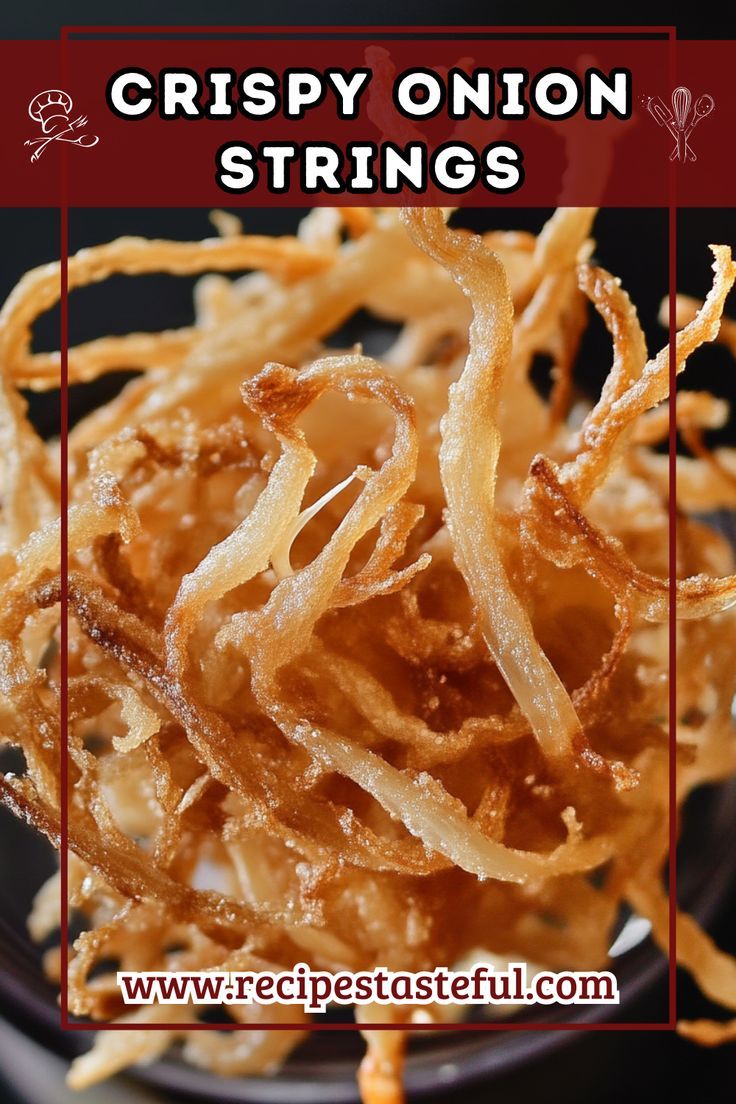 crispy onion strings on a black plate with the words crispy onion strings above it