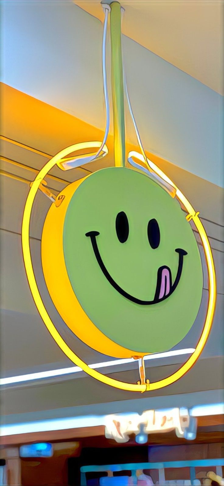 a smiley face light hanging from the ceiling