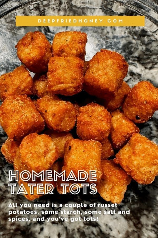 some tater tots are in a glass bowl on a marble counter top with the words homemade tater tots