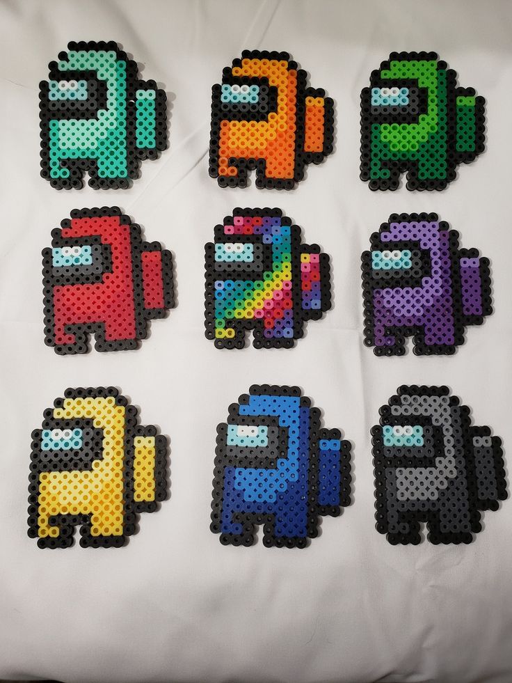 the pixel art is made with different colors and shapes, including letters that appear to be elephants