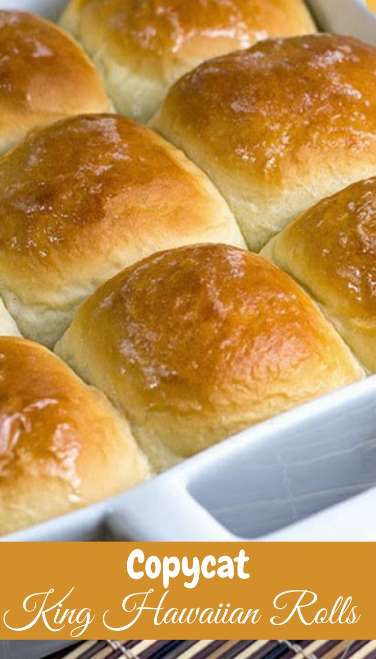 several rolls in a white baking dish with text overlay that reads copycat king hawaiian rolls