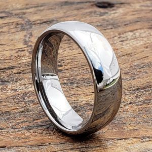 a wedding ring sitting on top of a wooden table