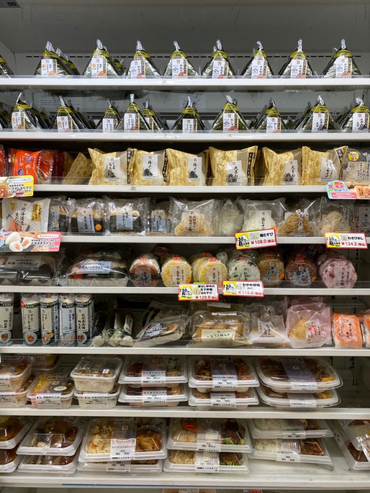 shelves in a grocery store filled with lots of food