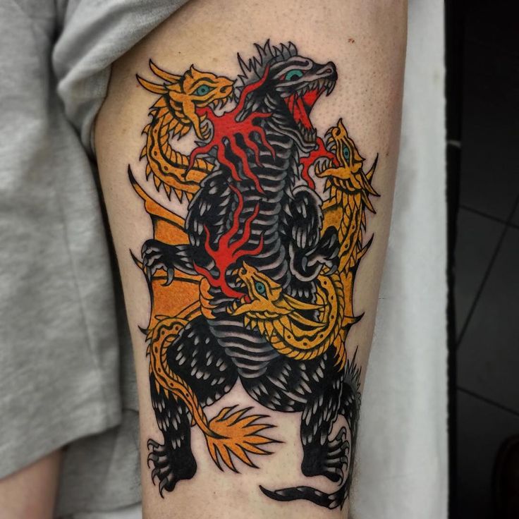 a man with a dragon tattoo on his arm