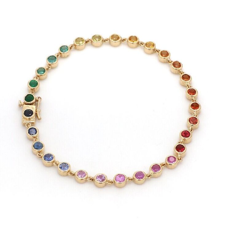 Multi Color Bracelet, Silver Bracelet, 925 Sterling Silver Multi Gemstone Bracelet, Silver Jewelry, Engagement Jewelry, 14K Gold Bracelet  Metal : 925 sterling silver  Style : Art Deco Main Stone  : Multi Sapphire  Stone Shape : Round Color : Multi Color Stone Size : 4 mm Stone Weight : 5.00 Ct  Silver Weight : 13.50 gm ( approx. ) This Bracelet Is Available In All Sizes Perfect for Wedding, Engagement, Cocktail, Party, Anniversary, Birthday, Christmas, Valentine's Day, Statement Occasions Metal Multi-stone 14k Yellow Gold Bracelets, Yellow Gold Sterling Silver Jubilee Tennis Bracelet, Fine Jewelry Multi-stone Bracelet As Gift, Fine Jewelry Multi-stone Bracelets For Gifts, Gold Multi-stone Bracelet As Gift, Sterling Silver Multi-stone Round Bracelet, Multi-stone Round Gold Bracelet As Gift, Round Multi-stone Gold Bracelet As Gift, Multi-stone Round Diamond Bracelet For Anniversary