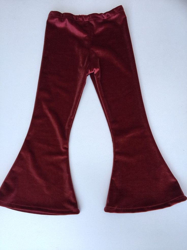 Velvet bottoms on velvet fabric Winter Full Length Bottoms With Elastic Waistband, Fitted Wide Leg Winter Bottoms, Winter Solid Full-length Bottoms, Non-stretch Flare Bottoms For Winter, Solid Flare Bottoms With Elastic Waistband, Fitted Winter Bottoms, Red Wide-leg Bottoms For Winter, Fitted Full-length Winter Bottoms, Stretch High-waisted Winter Pants