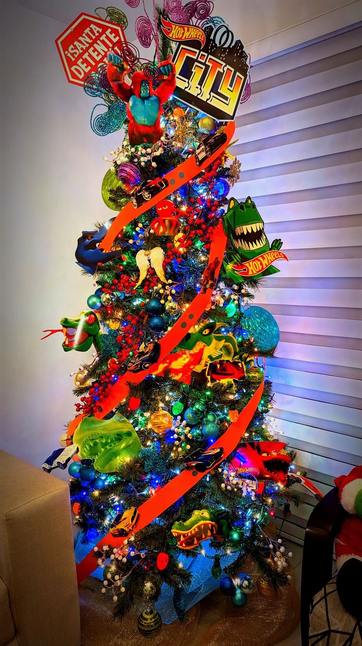 a brightly colored christmas tree decorated with toys