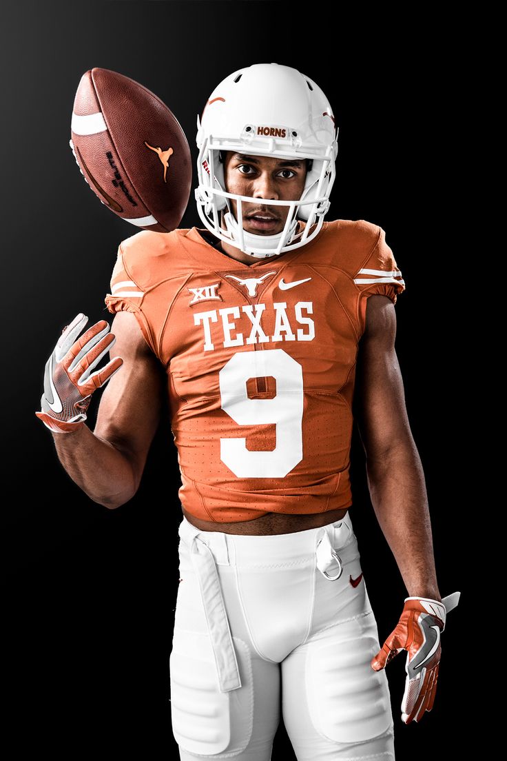 a texas football player is holding a football