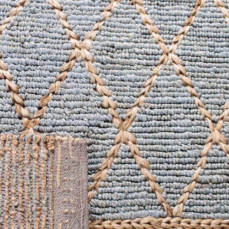 two different colored rugs with braided ends and woven edges, one in blue and the other in beige