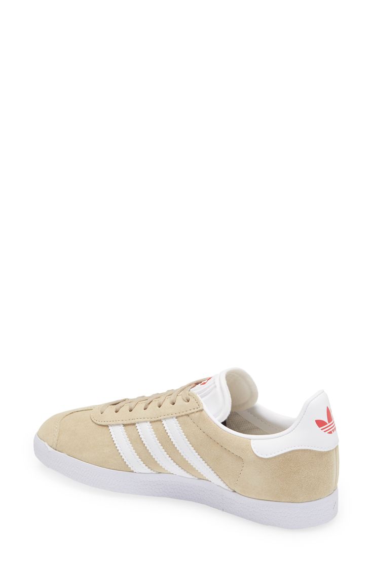 Initially designed as a training shoe for top athletes in 1991, adidas' iconic Gazelle sneaker has been refreshed with a sleek, narrower silhouette but retains the classic contrasting 3-Stripes and heel tab of the original, and is presented in throwback archival hues. Style Name:Adidas Gazelle Sneaker. Style Number: 5157452. Available in stores. Adidas Low-top Skate Shoes With Contrast Sole, Adidas Lace-up Skate Shoes With Rubber Sole, Adidas Sporty Custom Sneakers With Gum Sole, Adidas Retro Skate Shoes With Rubber Sole, Sporty Adidas Custom Sneakers With Gum Sole, Adidas Low-top Sneakers With Contrast Sole, Cream Skate Shoes With Gum Sole For Sports, Retro Adidas Skate Shoes With Rubber Sole, Adidas Urban Skate Shoes With Rubber Sole