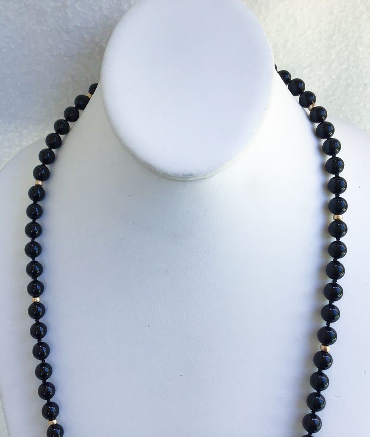 "A Truly Stunning Asian Hand Knotted Black Jade And 14k Beaded Necklace With A 10k Gold Charm From Wausau Attached Next To The 14k Interlocking Clasp In Superb Vintage Condition. The vintage statement necklace is all original and free of any damage of any kind. The black Jade beads are 1/4\" in diameter with hand knotting in between. The 14k gold beads measure 1/8\" in diameter. The 14k gold interlocking clasp is also marked with a hallmark of the maker. The necklace is 27\" in total length. Thi Classic Gold Hand-strung Necklace, 14k Gold Single Strand Jewelry With Round Beads, Formal Yellow Gold Beaded Necklace, Elegant Polished Yellow Gold Beads, Elegant Formal Hand-strung Beads, Elegant Yellow Gold Polished Beads, Elegant 8mm Rondelle Beaded Necklaces, 14k Gold Round Beads Jewelry, Formal 14k Gold Jewelry With Polished Beads