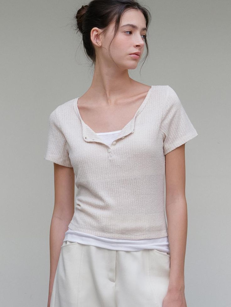 This is a minimal and feminine top by ourcomos that is made out of high quality and sturdy material. With distinctive mood of the design and comfortable wear, you can use it for your daily lifestyle.- Knit-like boucle fabric with soft touch- Slim fit with elasticity- Four button cosure on neckline Casual Summer Tops With Soft Texture, Versatile Short Sleeve Knit Top For Everyday, Versatile Everyday Knit Top With Short Sleeves, Chic Crew Neck Top With Soft Texture, Simple Beige Top For Everyday, Simple Everyday Beige Top, Chic Tops With Soft Texture And Relaxed Fit, Cream Tops With Soft Texture For Layering, Versatile Everyday Beige Tops