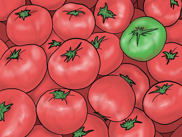 a bunch of tomatoes with green tops on them