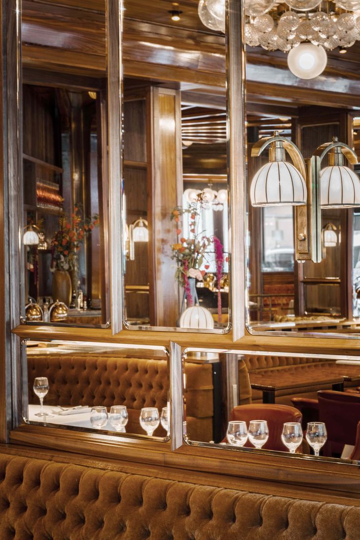 the interior of a fancy restaurant with chandeliers