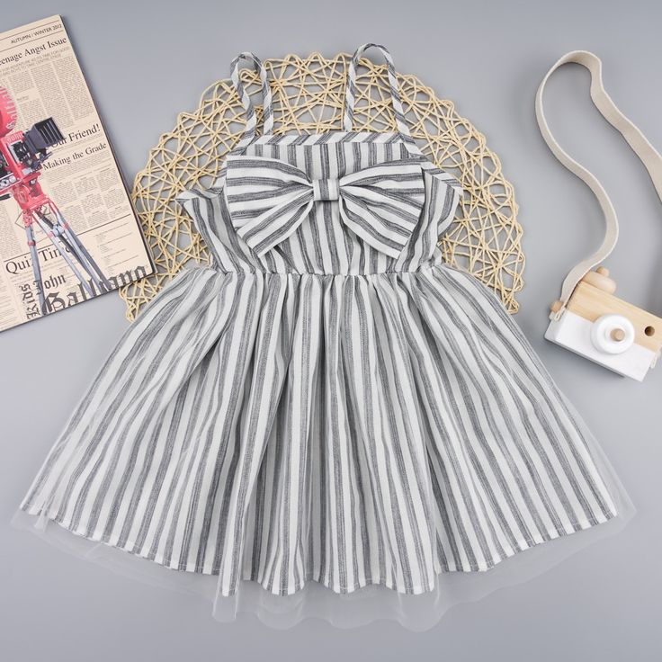 Accessories: No Pattern Type: Striped Style: Casual Features: Bow Neckline: Straight Length: Short Sleeve Length: Sleeveless Sleeve Type: Sleeveless Material Composition: 50% Cotton, 50% Polyester Care Instructions: Machine Wash Cold. Tumble Dry Low. Imported Product Measurements: 18-24m: Length 17.6 In, Bust 25.2 In, Waist 15.8 In 2t: Length 18.7 In, Bust 26.5 In, Waist 16.4 In 3t: Length 19.9 In, Bust 27.9 In, Waist 17 In 4t: Length 21.1 In, Bust 29.3 In, Waist 17.6 In 5t: Length 22.2 In, Bust Sassy Dress, Spaghetti Strap Dress, Stylish Kids, Childrens Fashion, Girl Clothes, Color Stripes, Strap Dress, Spaghetti Strap Dresses, Bow Detail