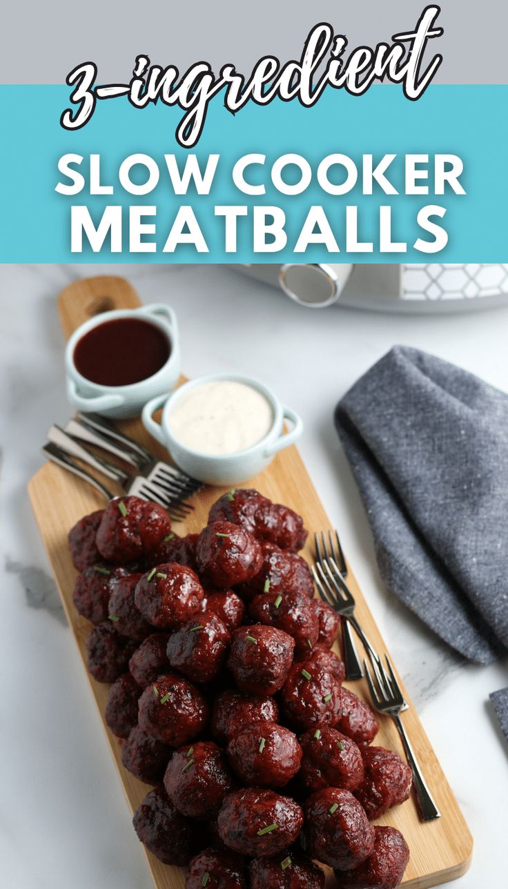 meatballs on a wooden cutting board with sauce and fork next to it, text reads 3 ingredient slow cooker meatballs