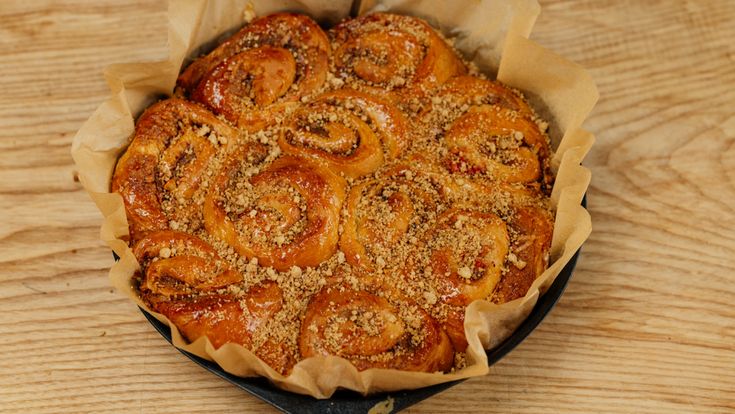 a pastry in a pan on a wooden table