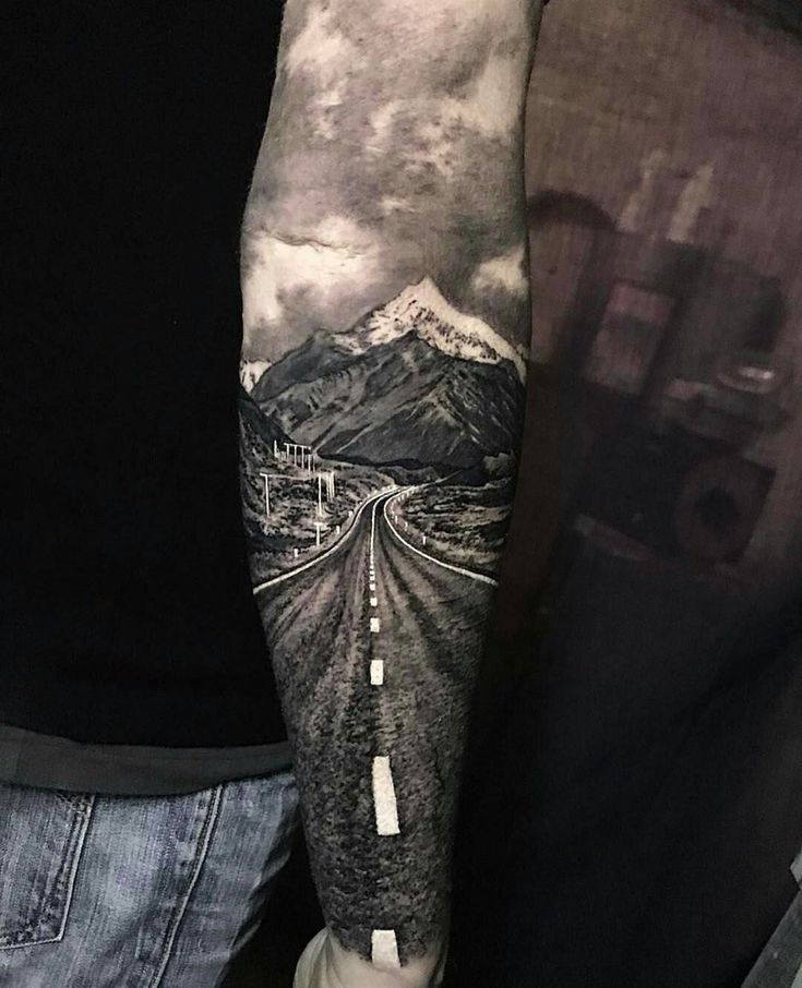 a person with a tattoo on their arm