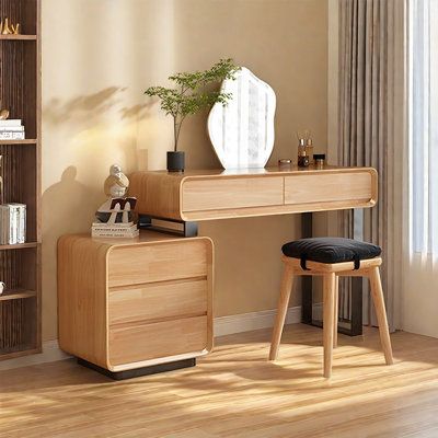 a wooden desk and chair in a room