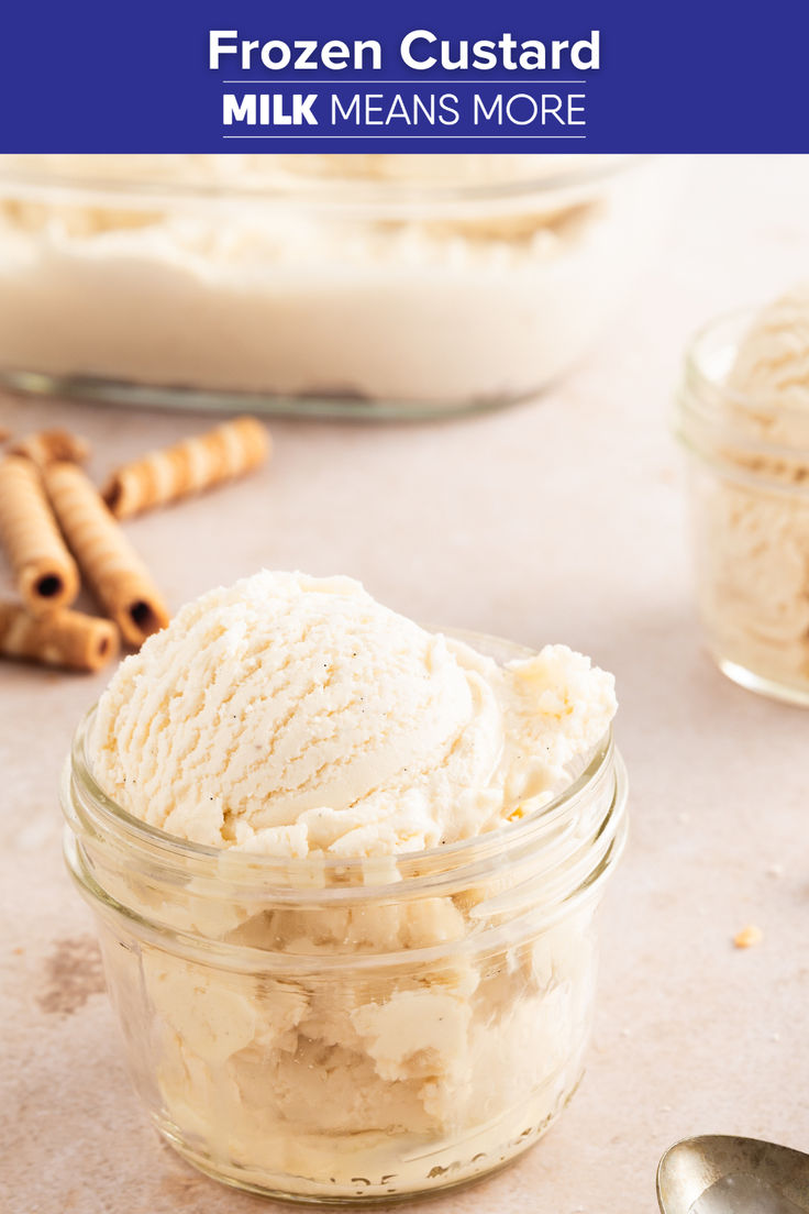 a glass jar filled with ice cream next to two spoons