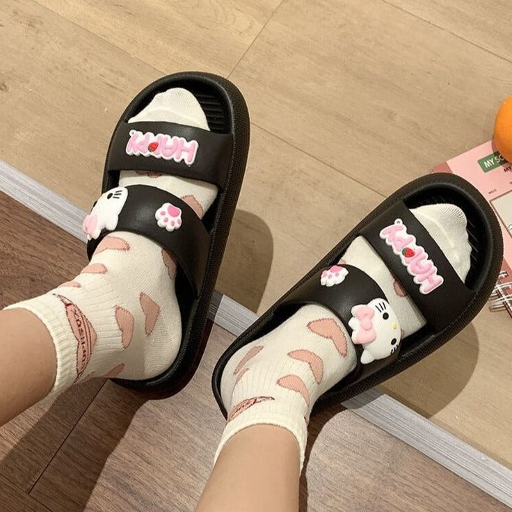 Step into summer with style and cuteness in our Sanrio Hello Kitty Slippers. These women's flat shoe sandals feature a double strap design that adds a trendy touch to any outfit. Perfect for sunny days and warm nights, they're the ultimate combination of comfort and adorable Hello Kitty charm. Casual Non-slip Jelly Sandals For Spring, Cute Slip-on Slippers For Summer, Cute Non-slip Spring Slippers, Cute Non-slip Slippers For Spring, Trendy Flat Leisure Slippers, Casual Slip-on Jelly Sandals For Spring, Trendy Non-slip Sandals For Leisure, Trendy Summer Sandals For Leisure, Trendy Flat Sandals For Leisure