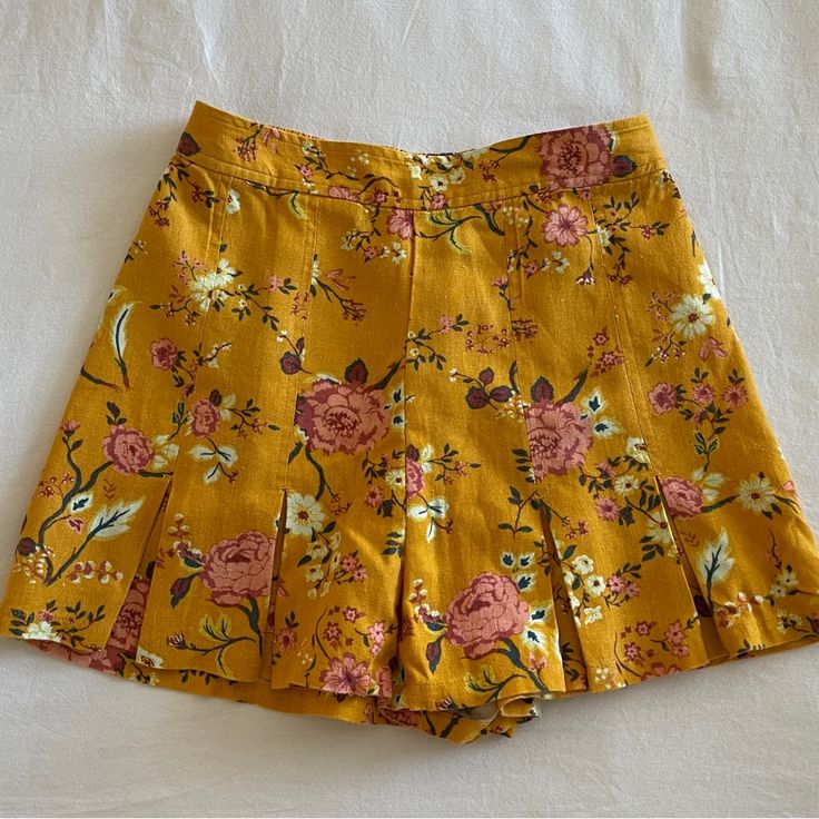 Mustard Yellow Floral Skirt With Front Pleats. 55% Linen And 45% Rayon Never Worn - No Tags Spring Summer Skirted Shorts, Spring Skirted Shorts For Summer, Summer Floral Print Skirted Bottoms, Summer Fitted Shorts With Lined Skirt, Fitted Summer Shorts With Lined Skirt, Pleated Mini Bottoms For Summer, Fitted Skirted Summer Bottoms, Pleated Mini Length Bottoms For Summer, Fitted Floral Print Shorts