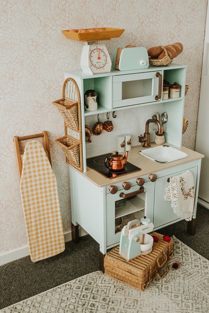 a toy kitchen with an oven and sink