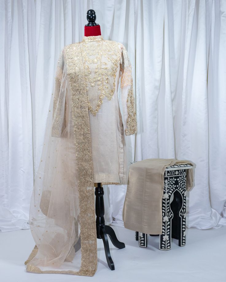 From the designer's 2018 unstitched party collection. No label. 3 pieces. Elegant Jamawar Lawn Suit For Festivals, Elegant Sherwani With Sheer Dupatta For Eid, Elegant Jamawar Lawn Suit For Wedding, Elegant Semi-stitched Silk Sherwani, Elegant Jamawar Salwar Kameez For Festivals, Elegant Lawn Suit With Dabka For Festivals, Festive Raw Silk Lawn Suit With Traditional Drape, Elegant Eid Lawn Suit In Jamawar, Elegant Semi-stitched Sherwani With Sheer Dupatta