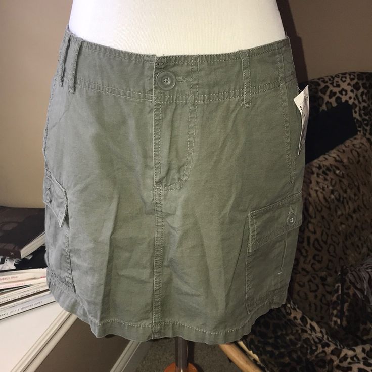 Olive/Army Green Cargo Skirt Nwt. 14” Waist To Hem. Perfect For Summer! Casual Stretch Skort With Pockets, Casual Skort With Side Pockets, Casual Stretch Cargo Skirt With Lining, Casual Short Cargo Skirt, Casual Fitted Cargo Skirt, Casual Green Mini Skirt With Pockets, Green Skort With Side Pockets For Spring, Spring Green Skort With Side Pockets, Green Fitted Cargo Skirt