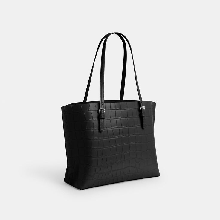 The Mollie Tote Bag is crafted of crocodile-embossed leather. It fits up to a 15 laptop and features a middle zip compartment that secures your essentials. This leather tote bag for women makes it easy to access your on-the-go items thanks to two open compartments. Carry it comfortably on your shoulder —it will keep up with you all day. Classic Crocodile Pattern Shoulder Bag For Work, Modern Crocodile Pattern Shoulder Bag For Office, Rectangular Crocodile Pattern Work Bag, Classic Everyday Bags With Crocodile Pattern, Modern Business Shoulder Bag With Crocodile Pattern, Classic Crocodile Pattern Bags For Everyday Use, Rectangular Crocodile Pattern Shoulder Bag For Work, Chic Workwear Bags With Crocodile Pattern, Black Crocodile Pattern Shoulder Bag For Work