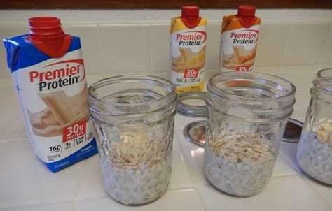 four jars filled with oatmeal sitting on top of a counter