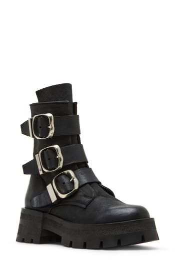 Bring a bit of moto edge to your everyday style in this lug-sole bootie accented with a trio of bold buckle straps. 2 1/4" heel 6 3/4" shaft Side zip closure Leather upper/synthetic lining and sole Imported Edgy Platform Boots With Buckle Closure And Round Toe, Edgy Heeled Boots With Buckle Closure And Round Toe, Ankle-high Moto Boots With Buckle For Work, Ankle-high Platform Boots With Buckle Punk Style, Ankle-high Platform Boots With Buckle Closure Punk Style, Ankle-high Moto Boots With Buckle Closure For Workwear, Edgy Boots With Metal Pin Buckle For Fall, Edgy Fall Boots With Metal Pin Buckle, Rugged Boots With Buckle Closure For Fall