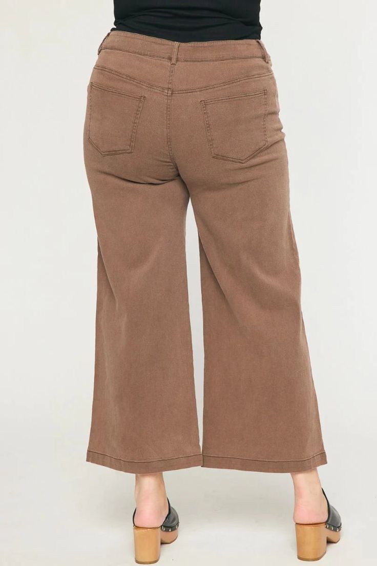 Brown denim wide leg pants These cute high waisted pants are both trendy and comfy! Black colored denim, featuring button and zipper front closure, five pocket design, and wide legs. You will love how great you feel in these babes everyday! True to size fit Stretch level: no stretch, some stretch, very stretchy Model is 5'9" wearing an XL Inseam on size small is 27" High-waisted Button and zipper front closure Five pocket design Wide leg Self: 97% Cotton, 3% Spandex. Lining: 100% Cotton Gentle w Chic Wide Leg Brown Jeans, Chic Brown Wide Leg Jeans, Chic Brown Wide Leg Flare Jeans, Trendy Brown Wide Leg Flare Jeans, Trendy Brown Wide-leg Flare Jeans, Fall Wide Leg Flare Jeans With Button Closure, Cotton Wide Leg Cropped Jeans For Fall, Wide-leg Cotton Cropped Jeans For Fall, Fall Mid-rise Wide Leg Pants With Button Closure