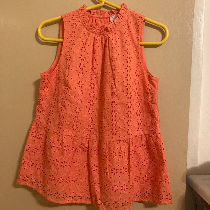 Cute Summery Sleeveless Shirt In Coral. Eyelet Peplum Shirt With Ruffled High Neckline. Inner Lining. Brand New, Never Worn, Tag Still On. Perfect With A White Pair Of Shorts Or Denim Jeans. Nwt. Orange Sleeveless Top For Spring, Sleeveless Tops For Beach In Spring, Orange Vest Top For Spring, Casual Pink Sleeveless Blouse, Fitted Sleeveless Vacation Blouse, Orange Sleeveless Cotton Tank Top, Orange Cotton Sleeveless Tank Top, Summer Orange Sleeveless Blouse, Orange Sleeveless Tank Top For Spring