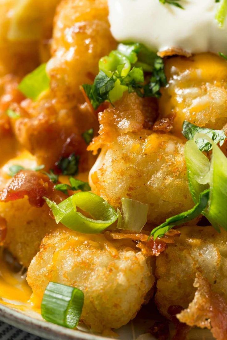 a close up of a plate of food with broccoli and cheese on it