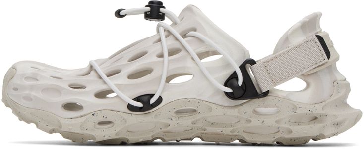 Lightweight water-resistant EVA foam rubber sandals in off-white. Cutouts throughout. · Bungee-style drawstring at vamp · Detachable logo-embossed velcro slingback strap · Logo embossed at footbed · BLOOM® and FloatPro™ Foam rubber midsole · Treaded Merrell Quantum Grip™ rubber outsole Supplier color: Moonbeam Hydro Moc, Merrell Sandals, Cage Sandals, Black Flip Flops, Rubber Sandals, Caged Sandals, Trail Running Shoes, Eva Foam, Hiking Shoes