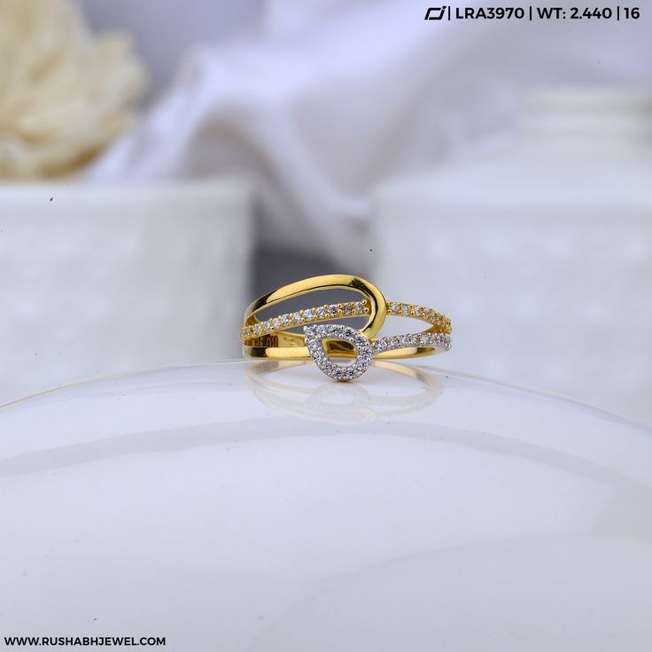 two wedding rings sitting on top of each other