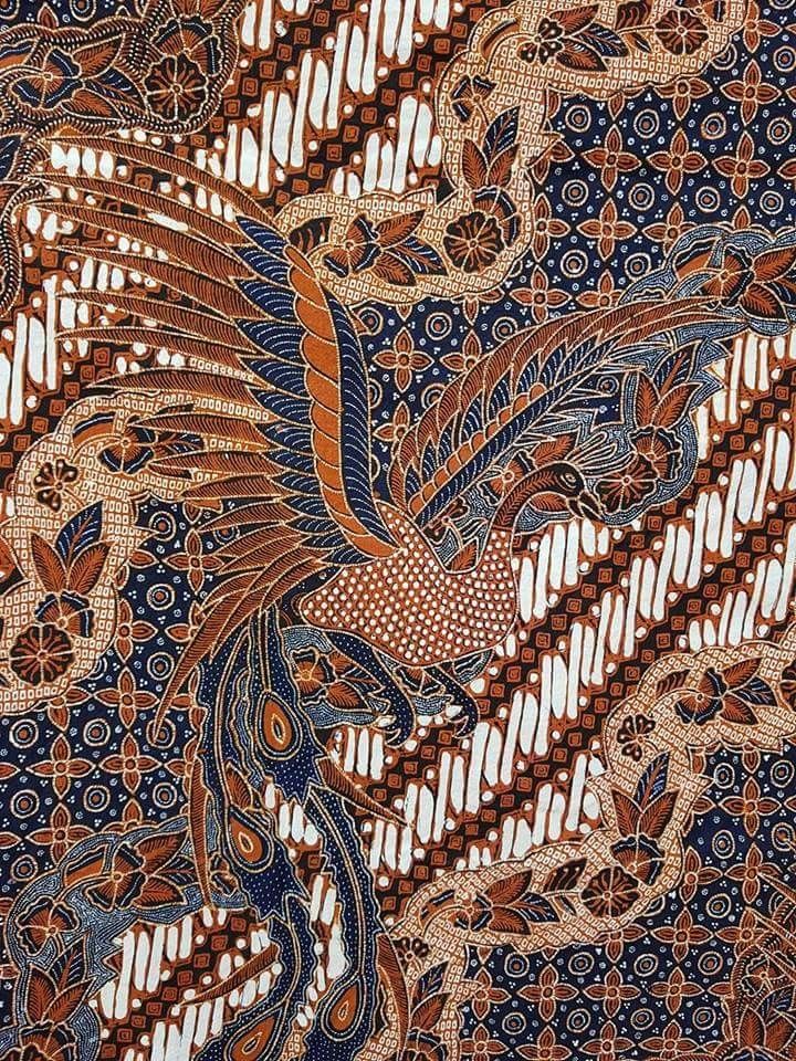 an intricately designed piece of cloth with birds on it