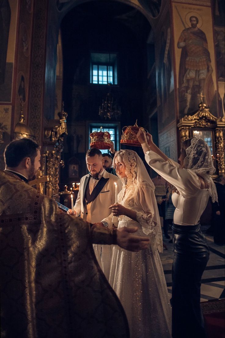 the bride and groom are getting ready to go into the church for their wedding ceremony