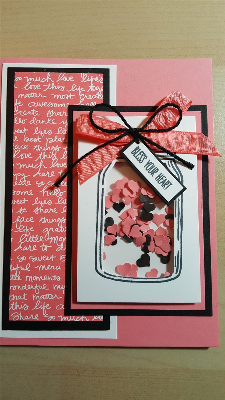 a handmade card with pink and black hearts in a mason jar on the front