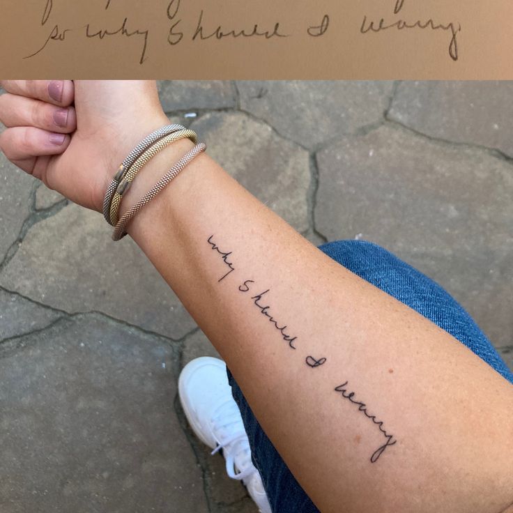 a woman's arm with writing on it